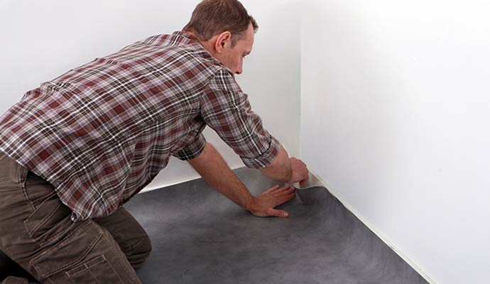 A professional of  installing new carpet