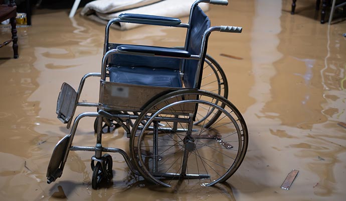 A wheelchair in a flooded room
