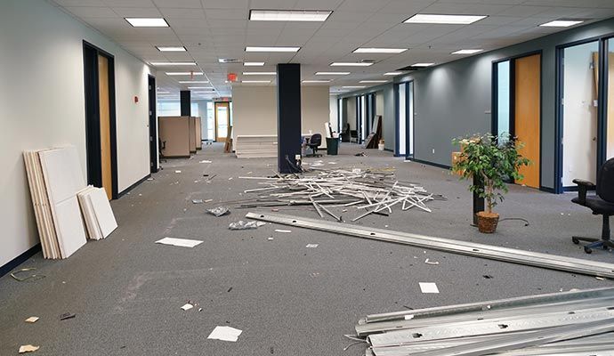 Debris scattered across a commercial office renovation site.