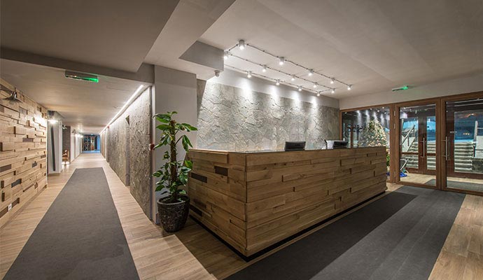 A modern hotel lobby and reception desk