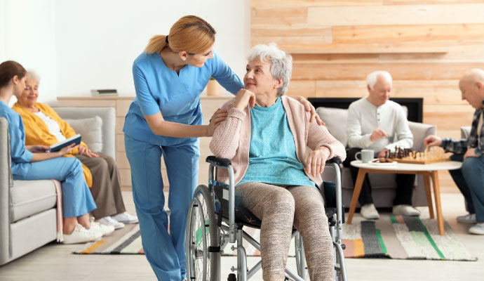 Nurse with resident in assisted living facility