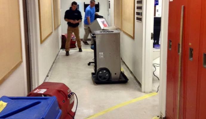 Water damage cleanup in hallway