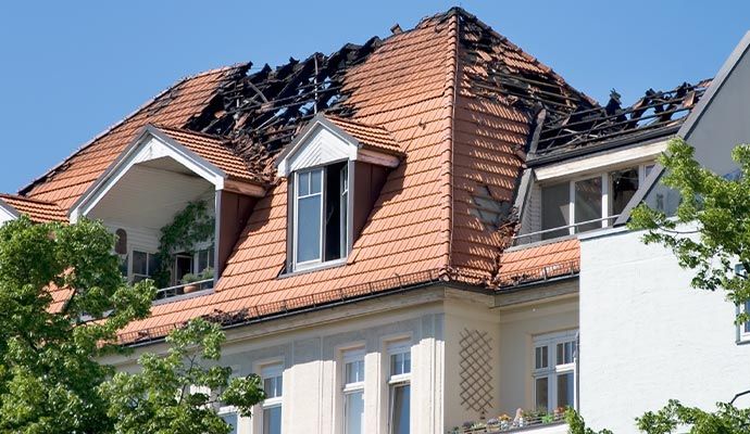 Fire damaged residential house roof