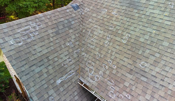 Wind damaged house roof