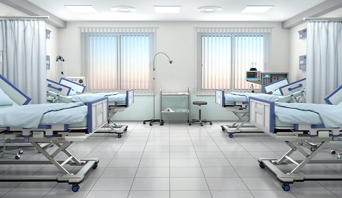Hospital ward with empty patient beds