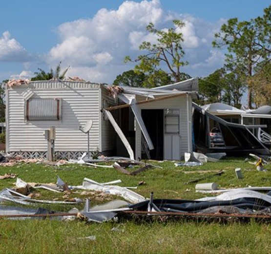 A mobile home severely damaged by a hurricane or storm