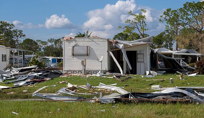 A mobile home severely damaged by a hurricane or storm