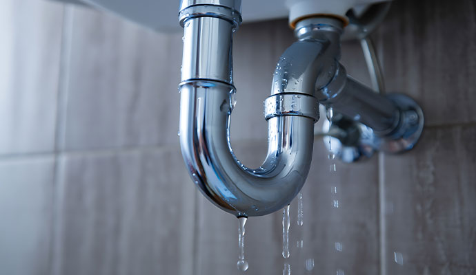 Leaking water from sink drain pipe