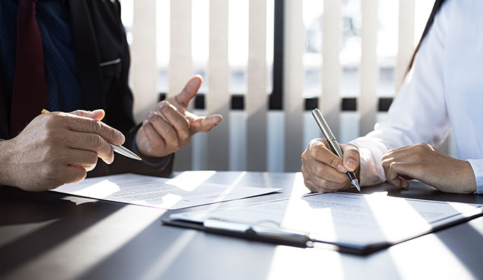 Signing insurance paper