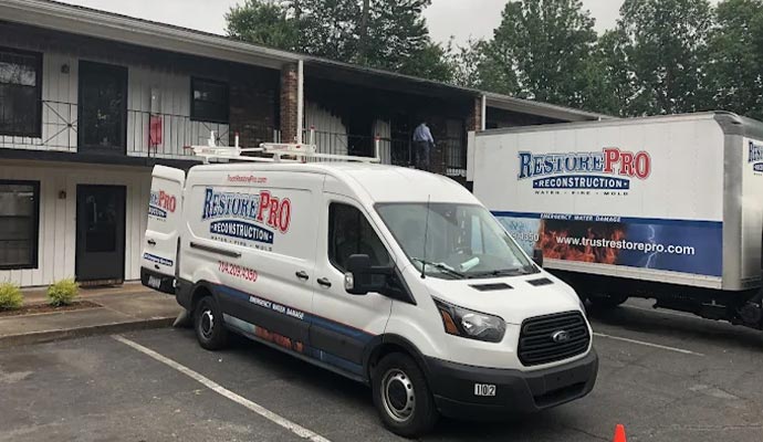 Two service vehicles of RestorePro Reconstruction