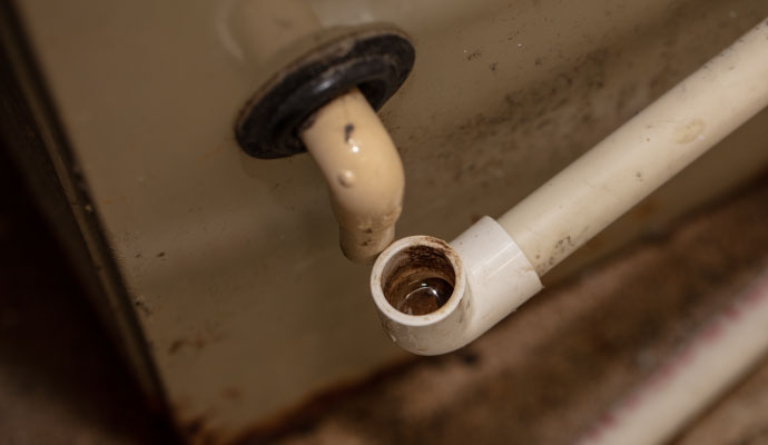 Water overflowing from AC pipe